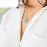 Wyland’s Small Open Whale Tail Necklace + Recycled Blue Glass Bead