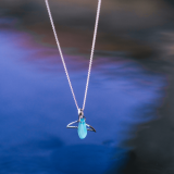 Wyland’s Small Open Whale Tail Necklace + Recycled Blue Glass Bead