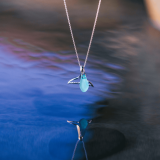 Wyland’s Small Open Whale Tail Necklace + Recycled Blue Glass Bead